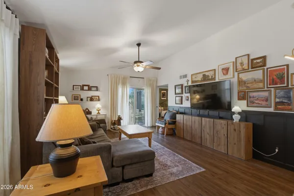 a living room with furniture and a large window