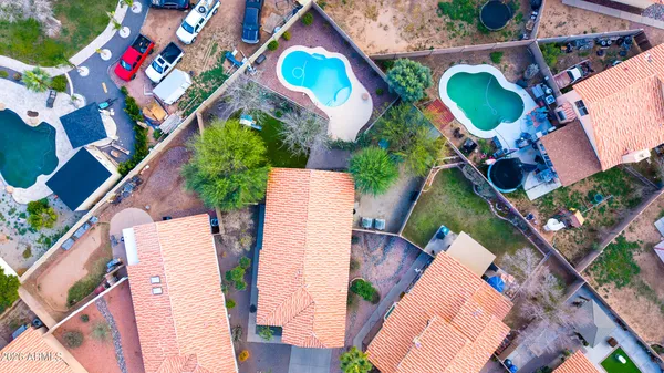 an aerial view of a house with outdoor space