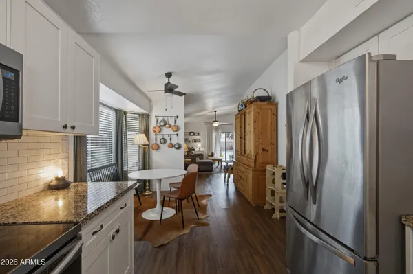 a bedroom with bed and a chandelier