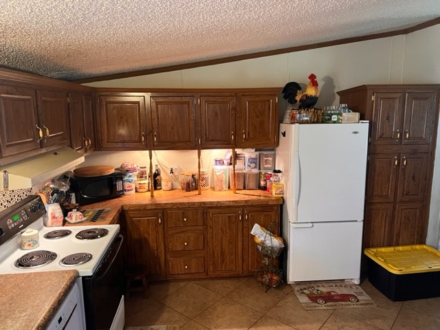 96735 Blackrock Road Yulee, FL 32097 - Photo 21 of 46 a kitchen with a sink a stove and a refrigerator