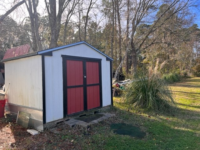 96735 Blackrock Road Yulee, FL 32097 - Photo 8 of 46 a view of backyard with large tree and wooden fence