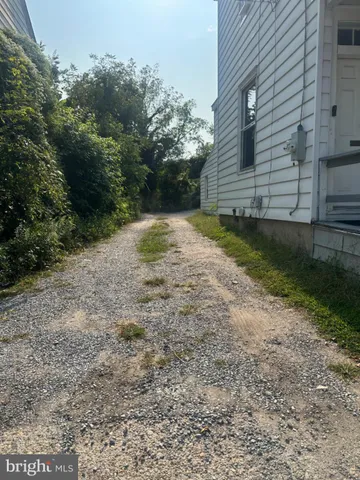 a view of backyard with green space