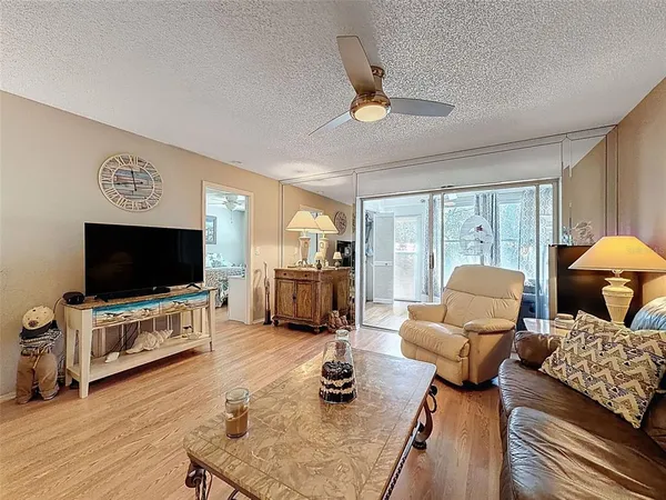 a living room with furniture and a window