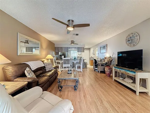a bedroom with a bed and flat screen tv