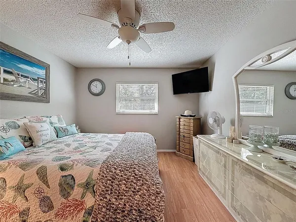 a bathroom with a sink vanity mirror and toilet