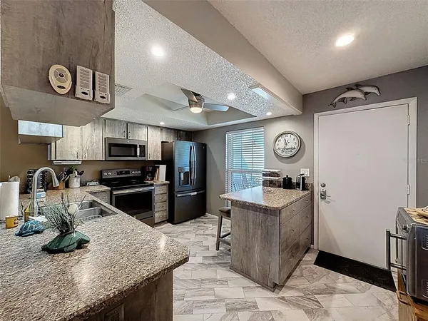 a kitchen with granite countertop lots of counter top space
