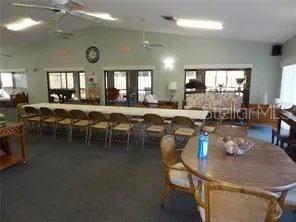 a view of a chair and table in the house