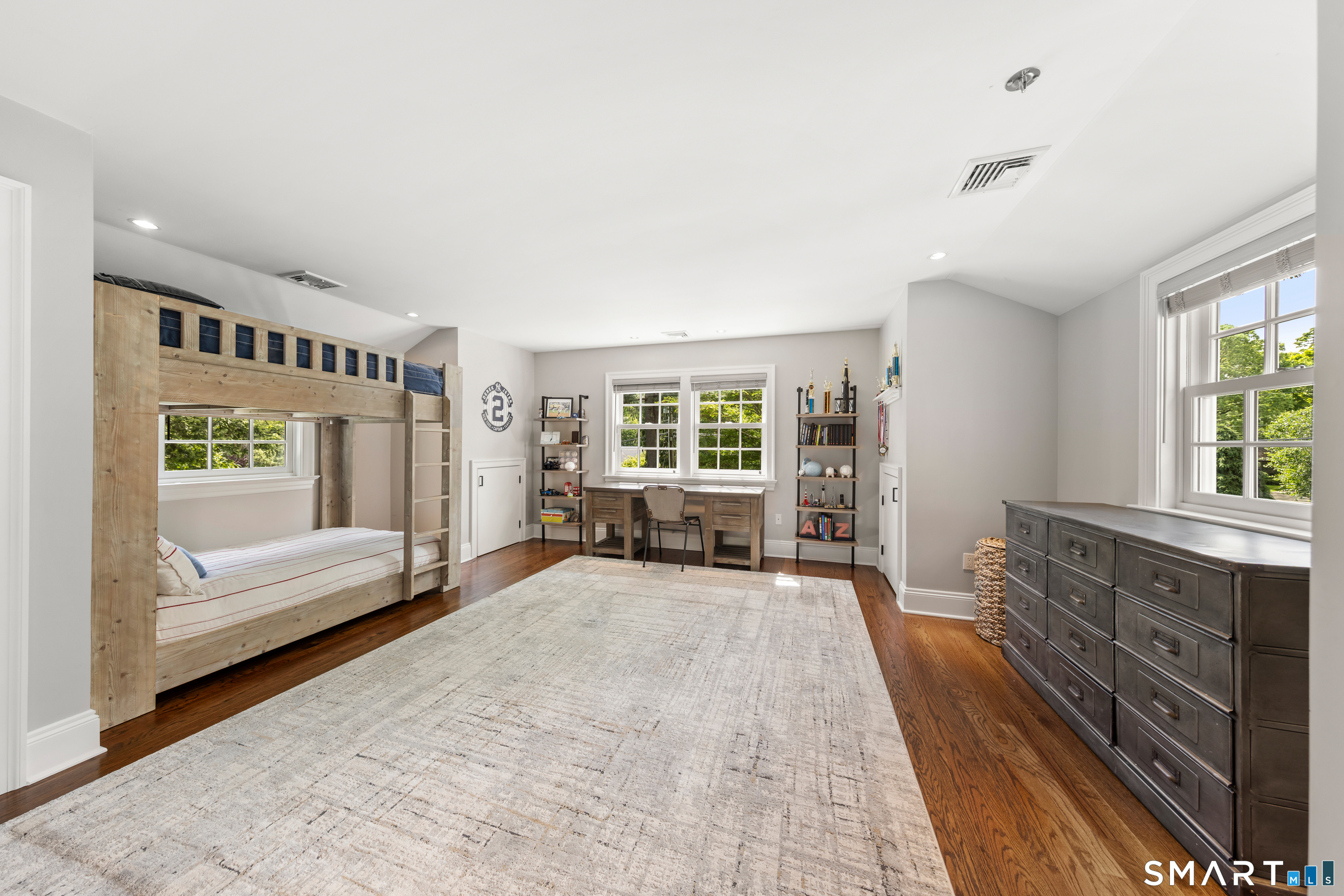 99 Hickok Road New Canaan, CT 06840 - Photo 21 of 39 a spacious bedroom with a large bed and a window