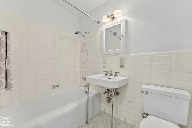 a kitchen with a refrigerator and a stove