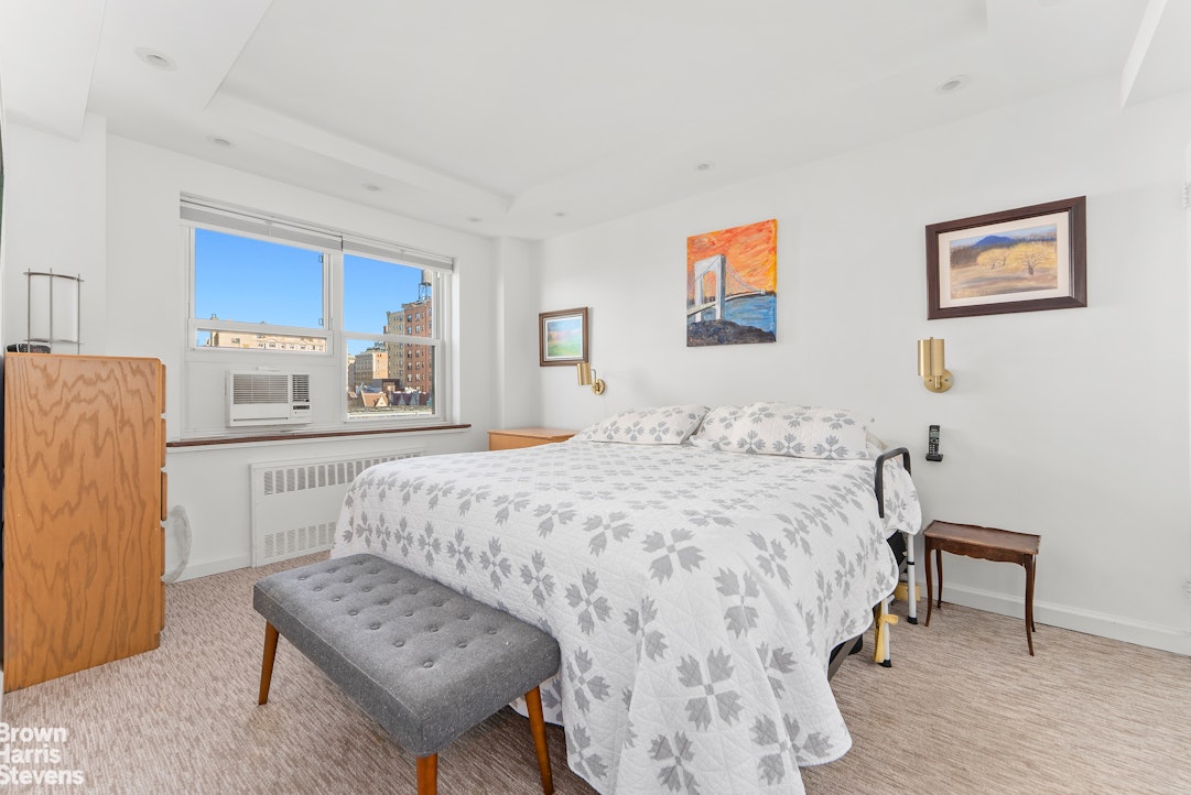 11 Riverside Drive, Unit 9DEW Manhattan, NY 10023 - Photo 4 of 20 a bedroom with a bed a desk and chair with the wooden floor