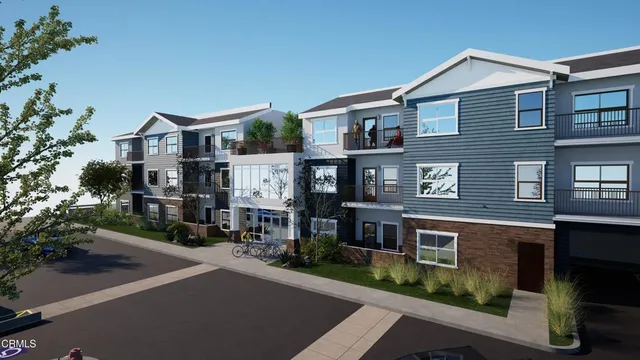 a view of multiple houses with a street