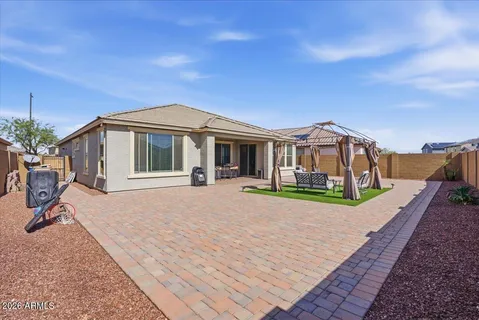 a view of an chairs and table in the patio