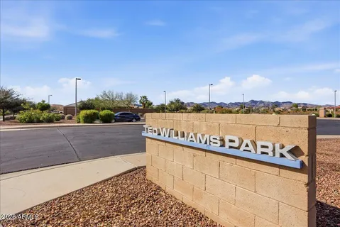 a view of a lake with houses in the back