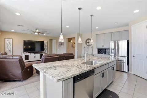 a kitchen with appliances cabinets and furniture