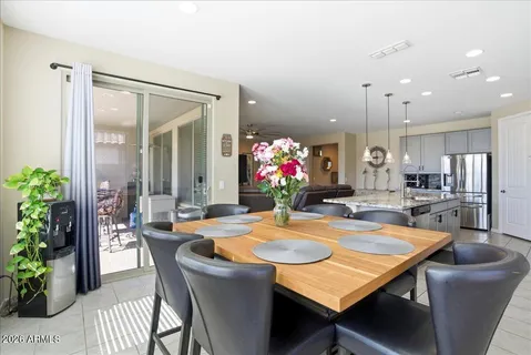 a dining room with furniture and window