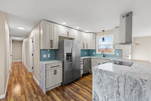 a kitchen with a sink and cabinets