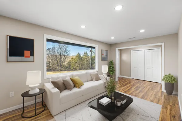 a kitchen with stainless steel appliances granite countertop a refrigerator a stove and a sink with cabinets