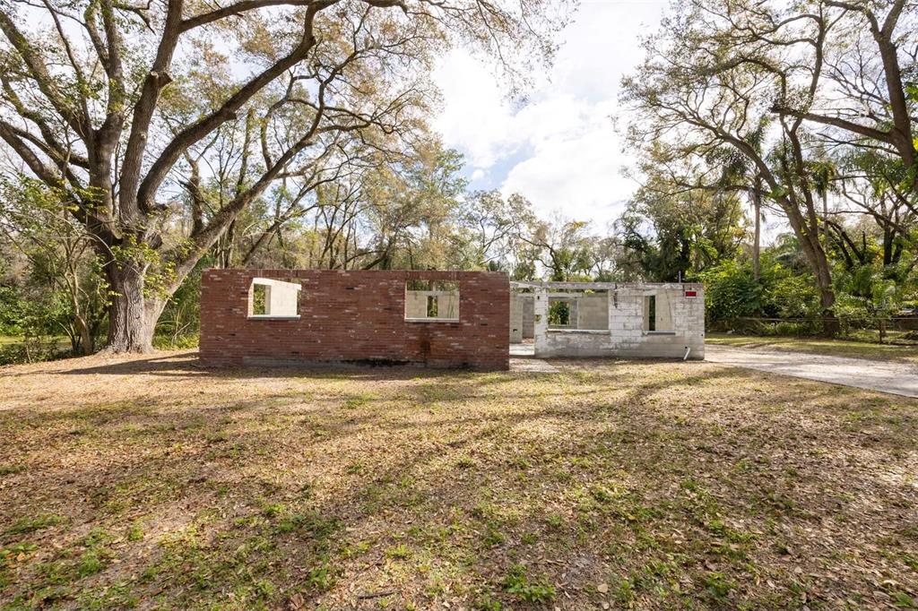 5515 North Falkenburg Road Tampa, FL 33610 - Photo 3 of 8 a house with trees in front of it
