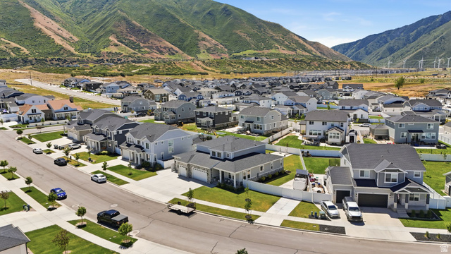1165 West Union Bench Drive Mapleton, UT 84664 - Photo 49 of 61 Spacious residential development featuring a collection of two-story homes with dark shingle roofs, light-toned siding, and attached garages