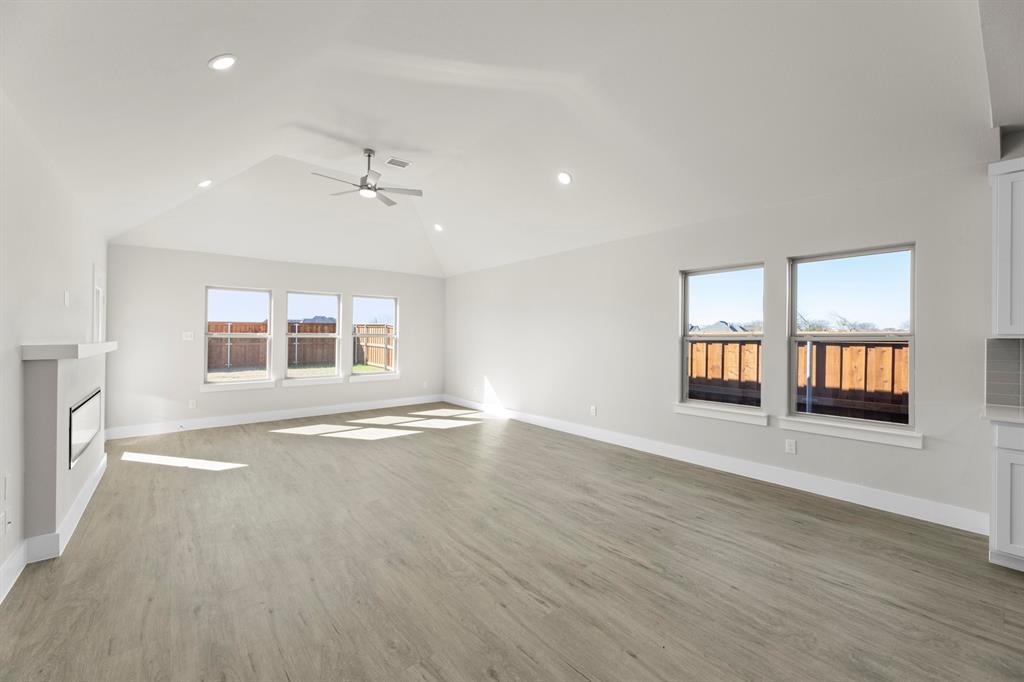 2359 Bell Way Forney, TX 75126 - Photo 18 of 31 an empty room with wooden floor and windows