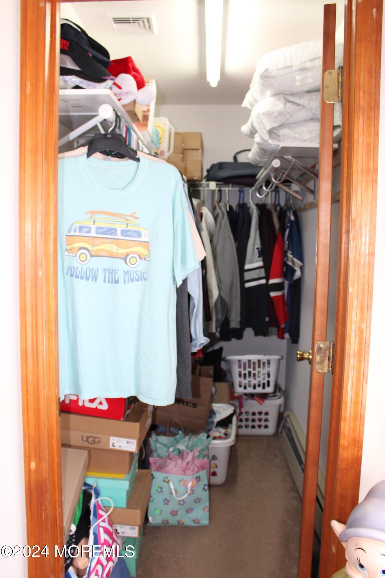 97 County Road Cliffwood, NJ 07721 - Photo 15 of 24 a view of walk in closet with clothes and shoes
