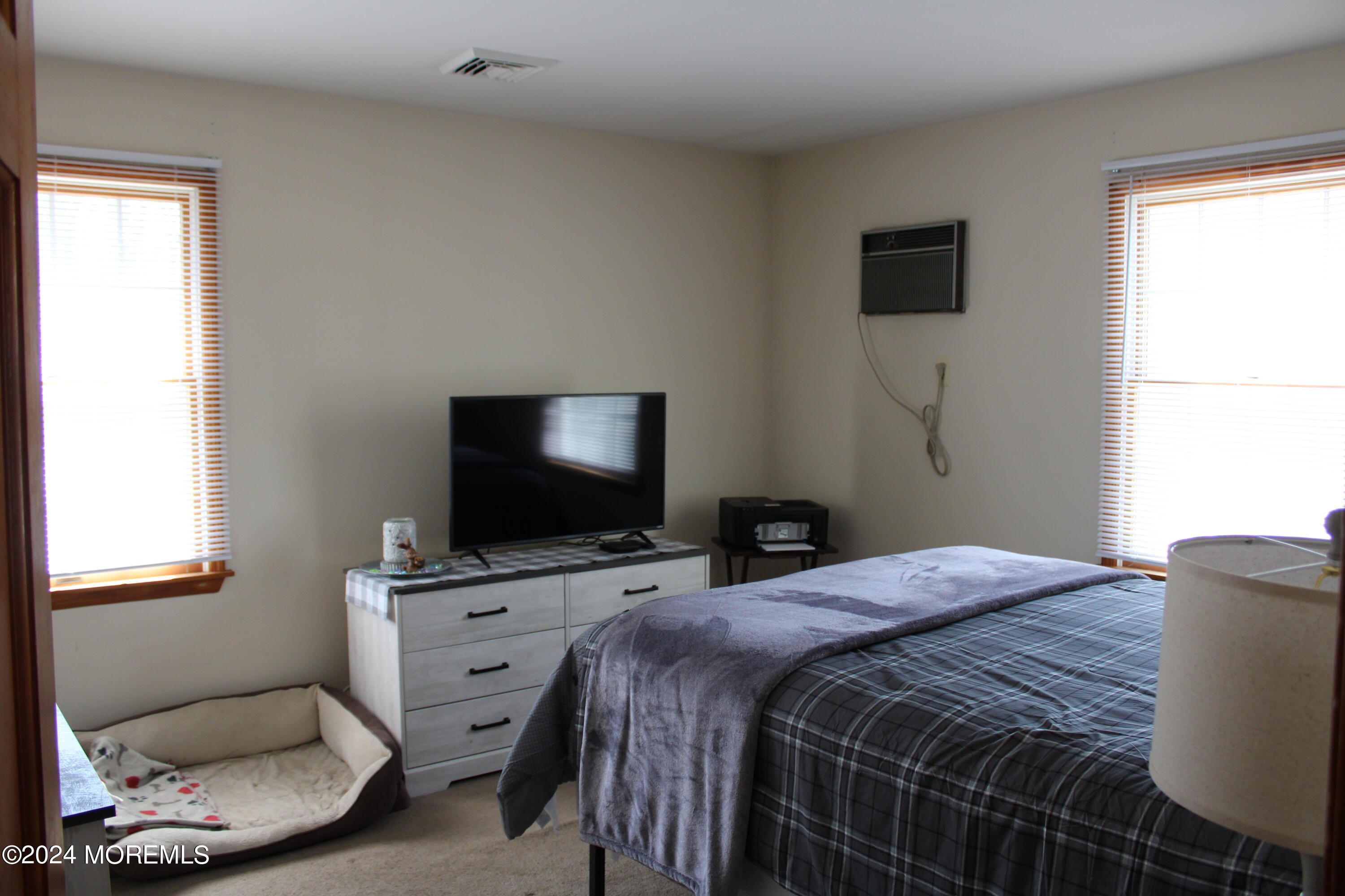 97 County Road Cliffwood, NJ 07721 - Photo 16 of 24 a bedroom with a bed and a flat screen tv