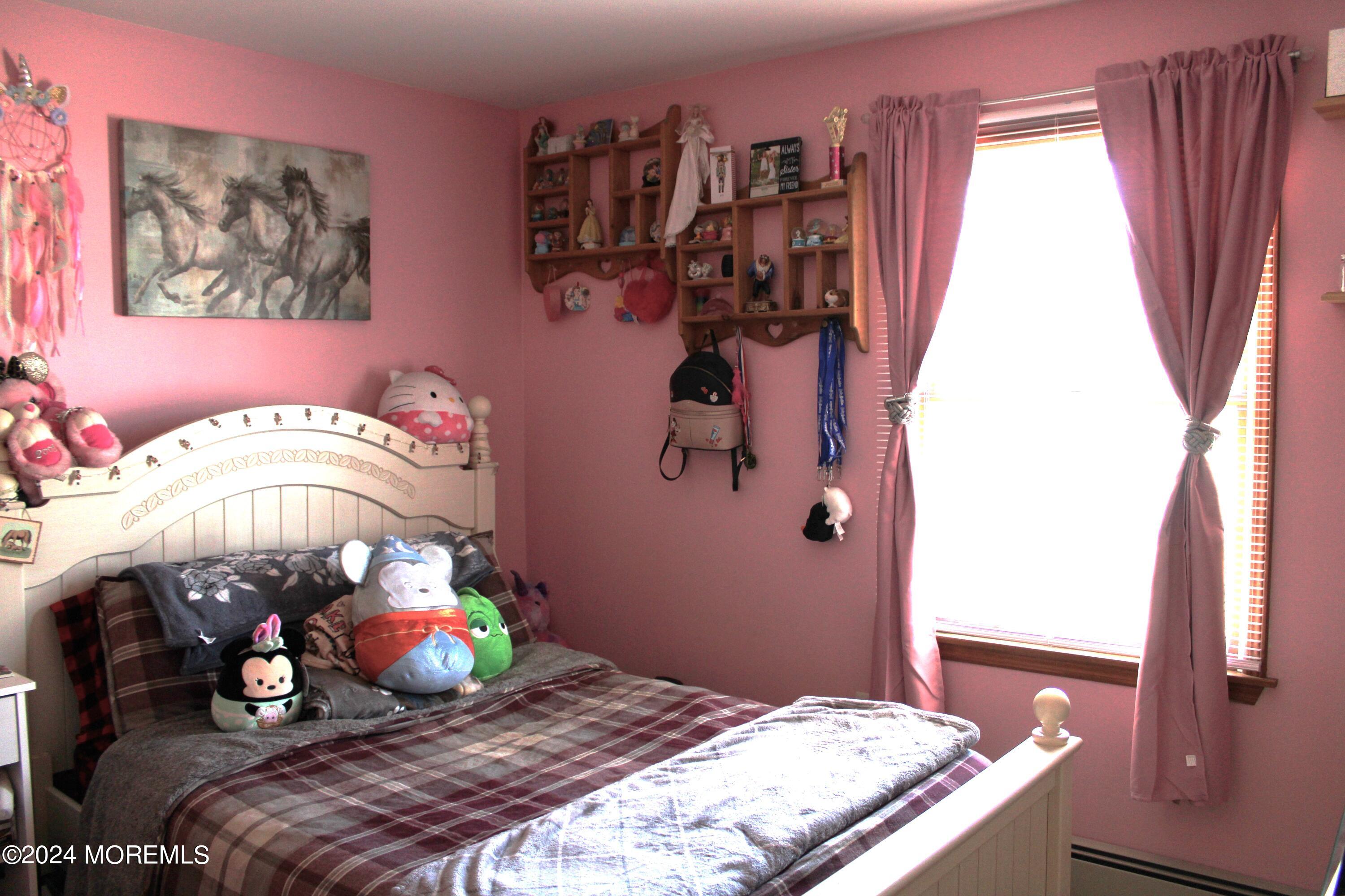 97 County Road Cliffwood, NJ 07721 - Photo 17 of 24 a bedroom with a bed and a window