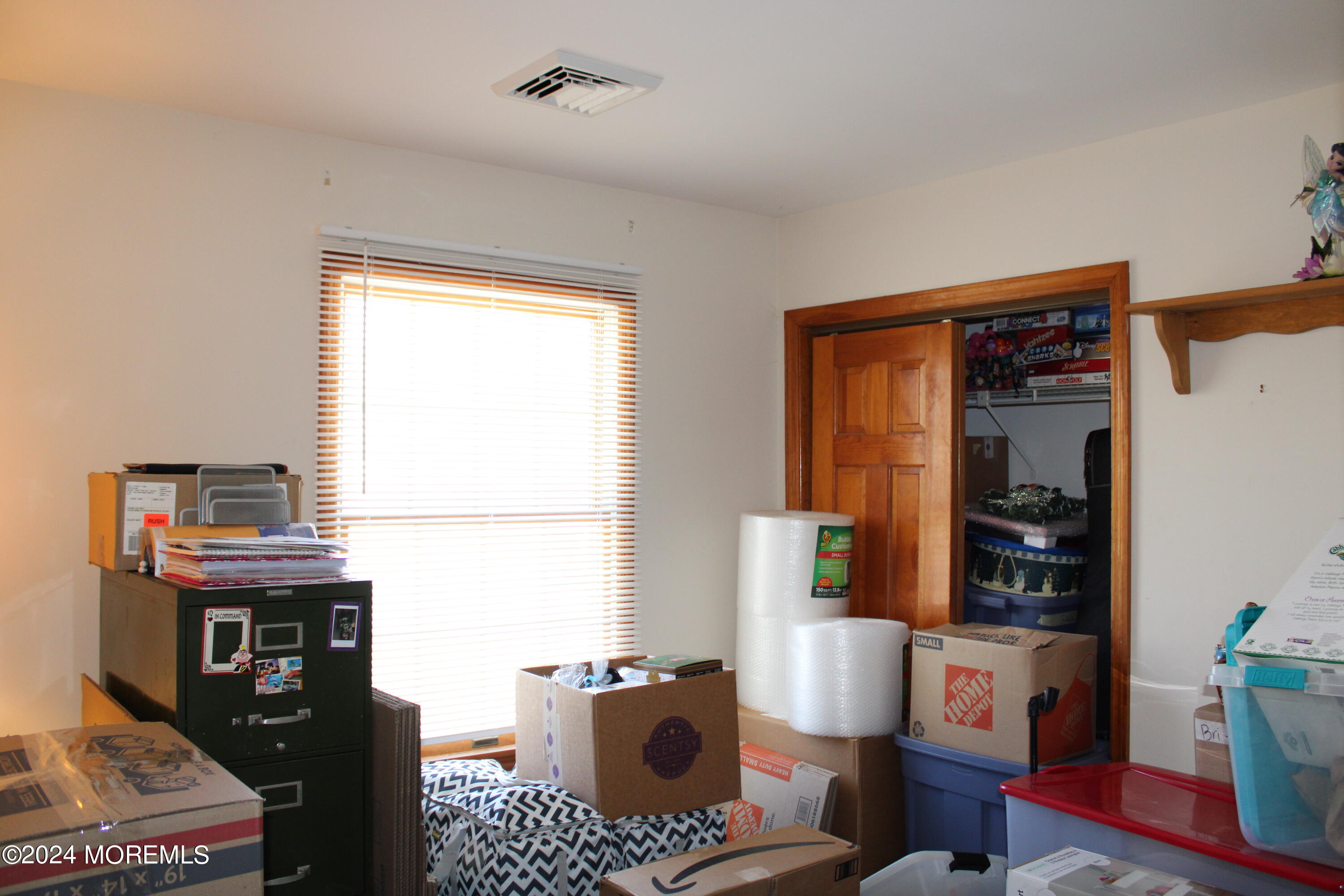 97 County Road Cliffwood, NJ 07721 - Photo 19 of 24 a bedroom with a bed and a window