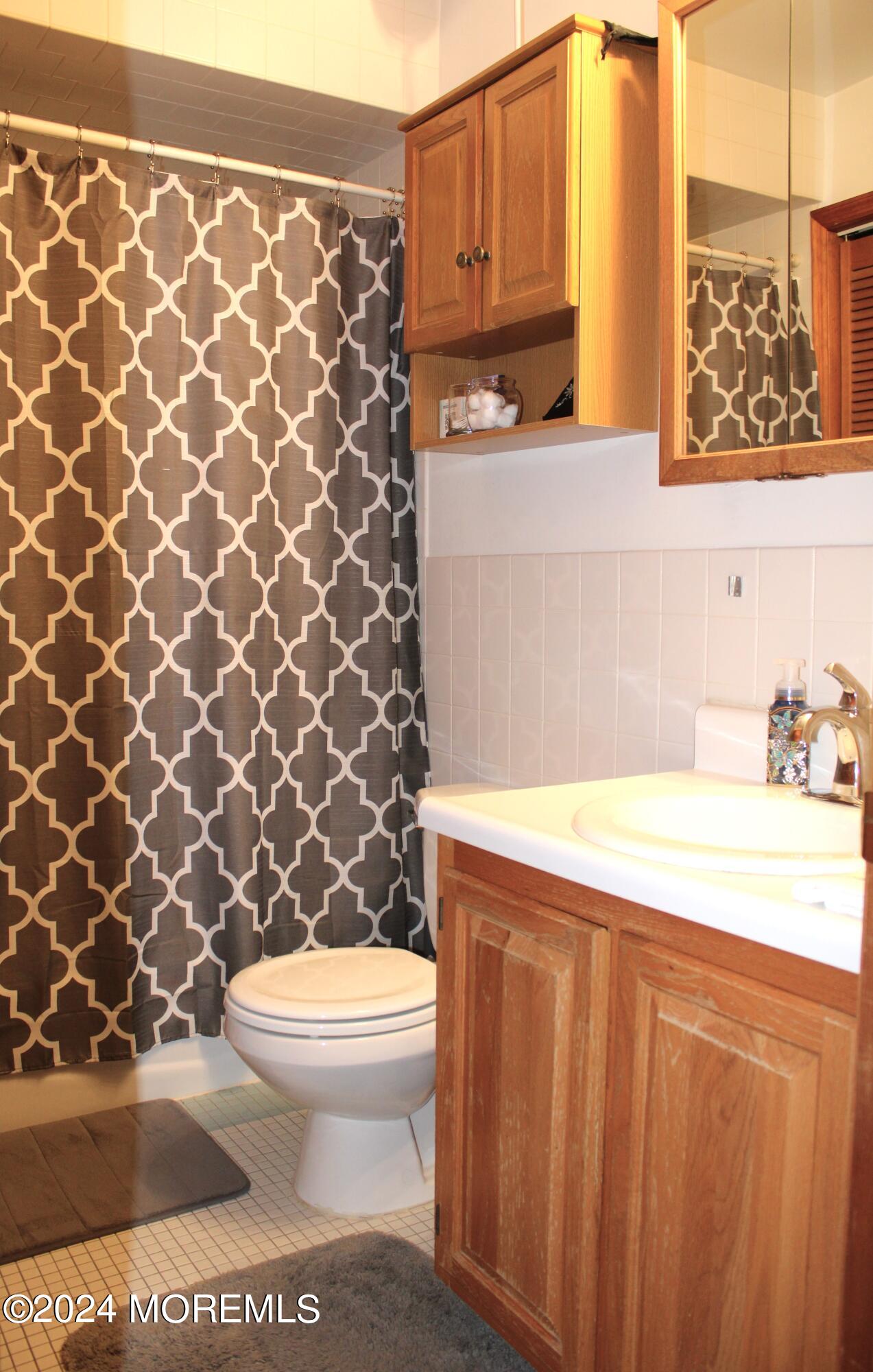 97 County Road Cliffwood, NJ 07721 - Photo 20 of 24 a bathroom with a toilet and a sink