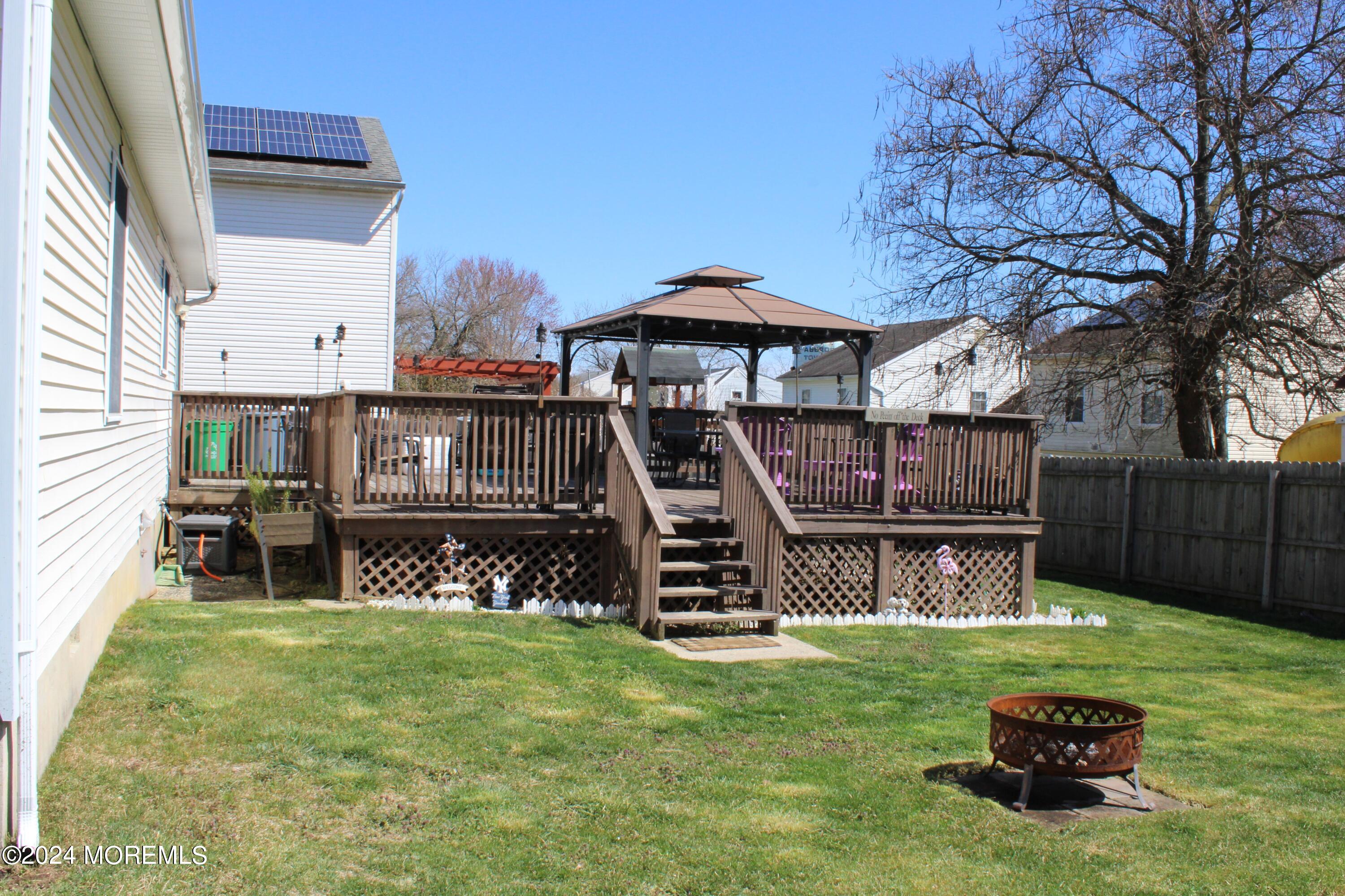 97 County Road Cliffwood, NJ 07721 - Photo 21 of 24 a view of a chair and table under an umbrella