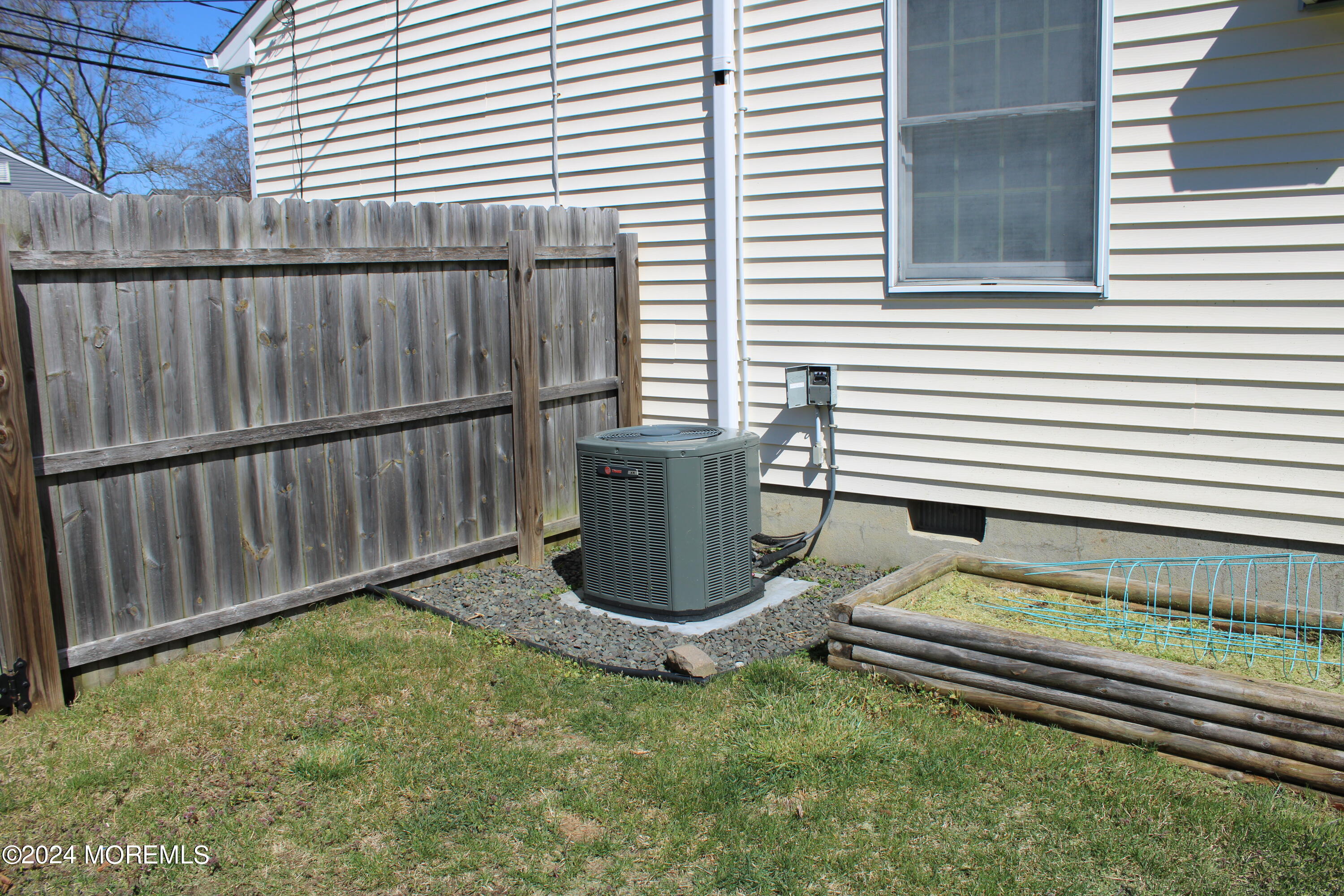 97 County Road Cliffwood, NJ 07721 - Photo 22 of 24 a view of a backyard with chairs and a wooden fence
