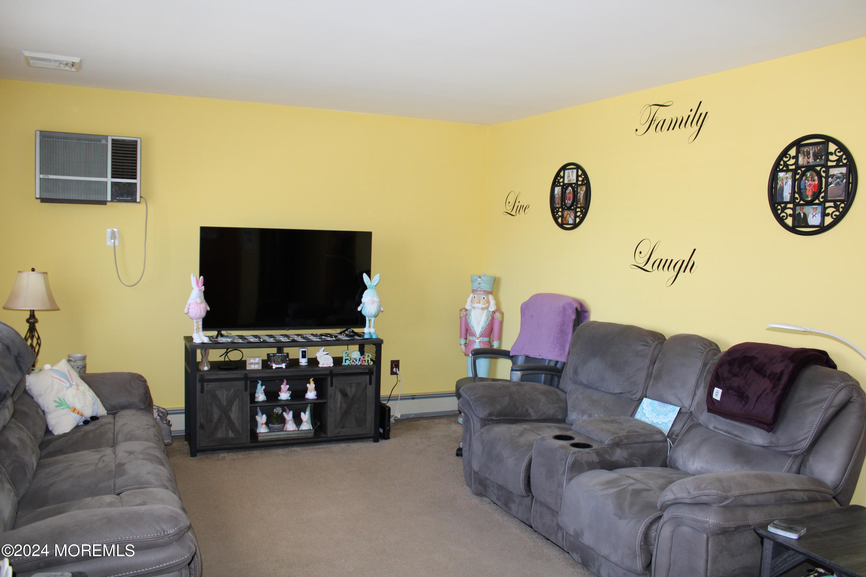 97 County Road Cliffwood, NJ 07721 - Photo 8 of 24 a living room with furniture and a flat screen tv