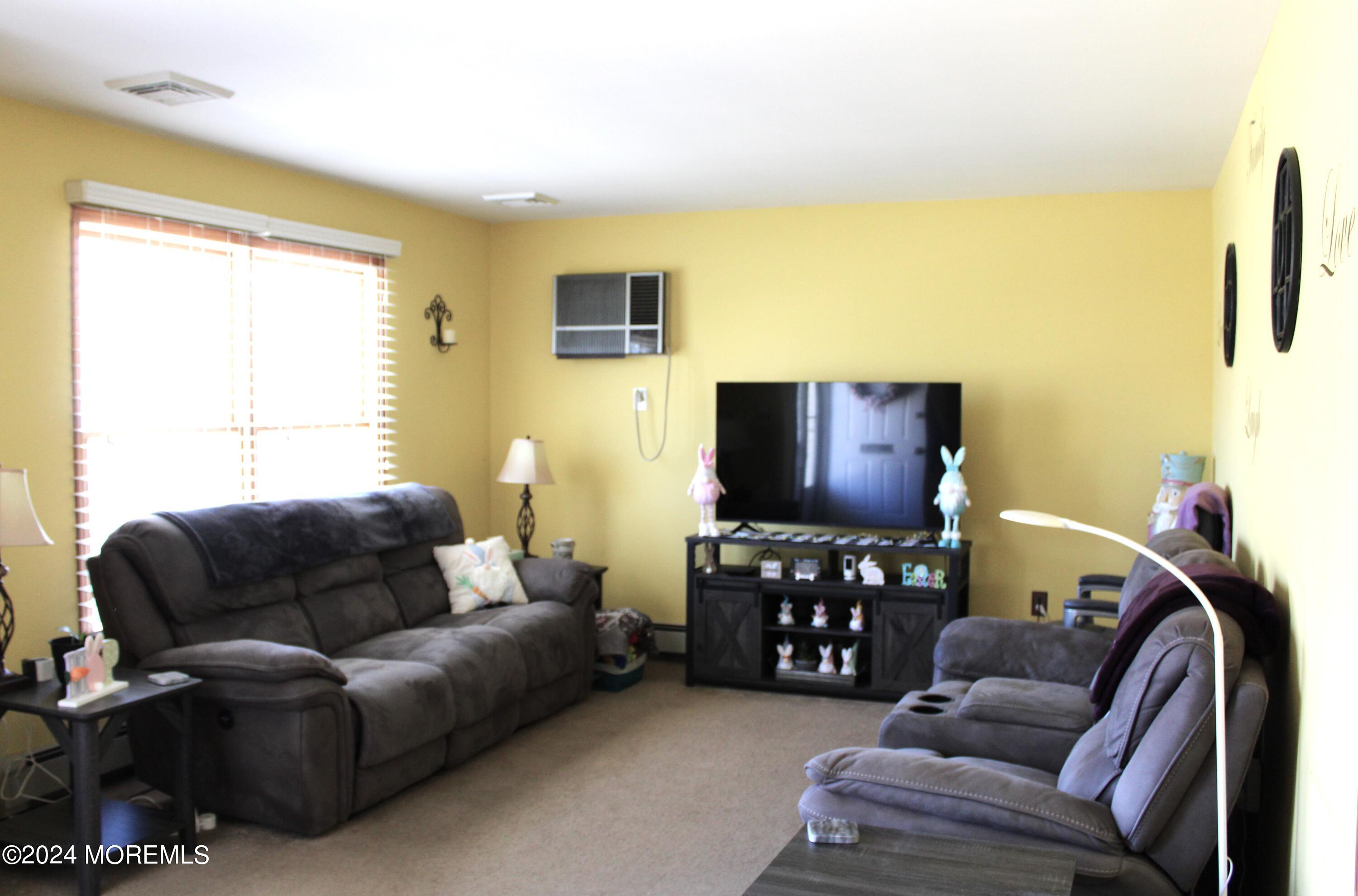 97 County Road Cliffwood, NJ 07721 - Photo 9 of 24 a living room with furniture and a flat screen tv