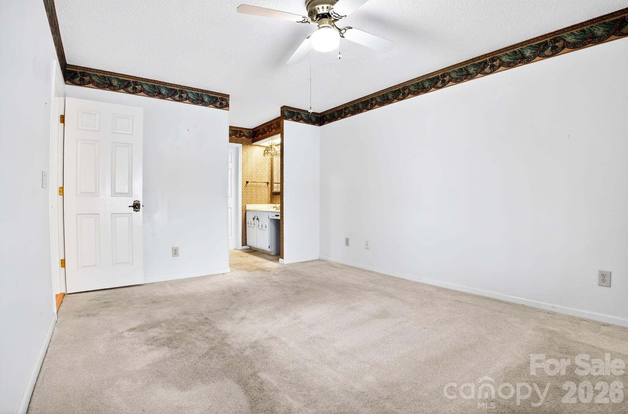 703 Independence Trail Morganton, NC 28655 - Photo 16 of 31 a view of a room with a ceiling fan and shower