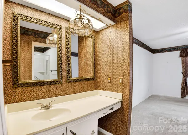 a bathroom with a sink and a mirror