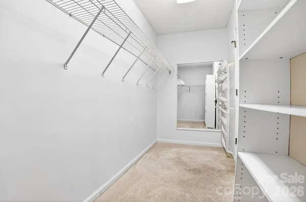 a view of a fan & a window in a room