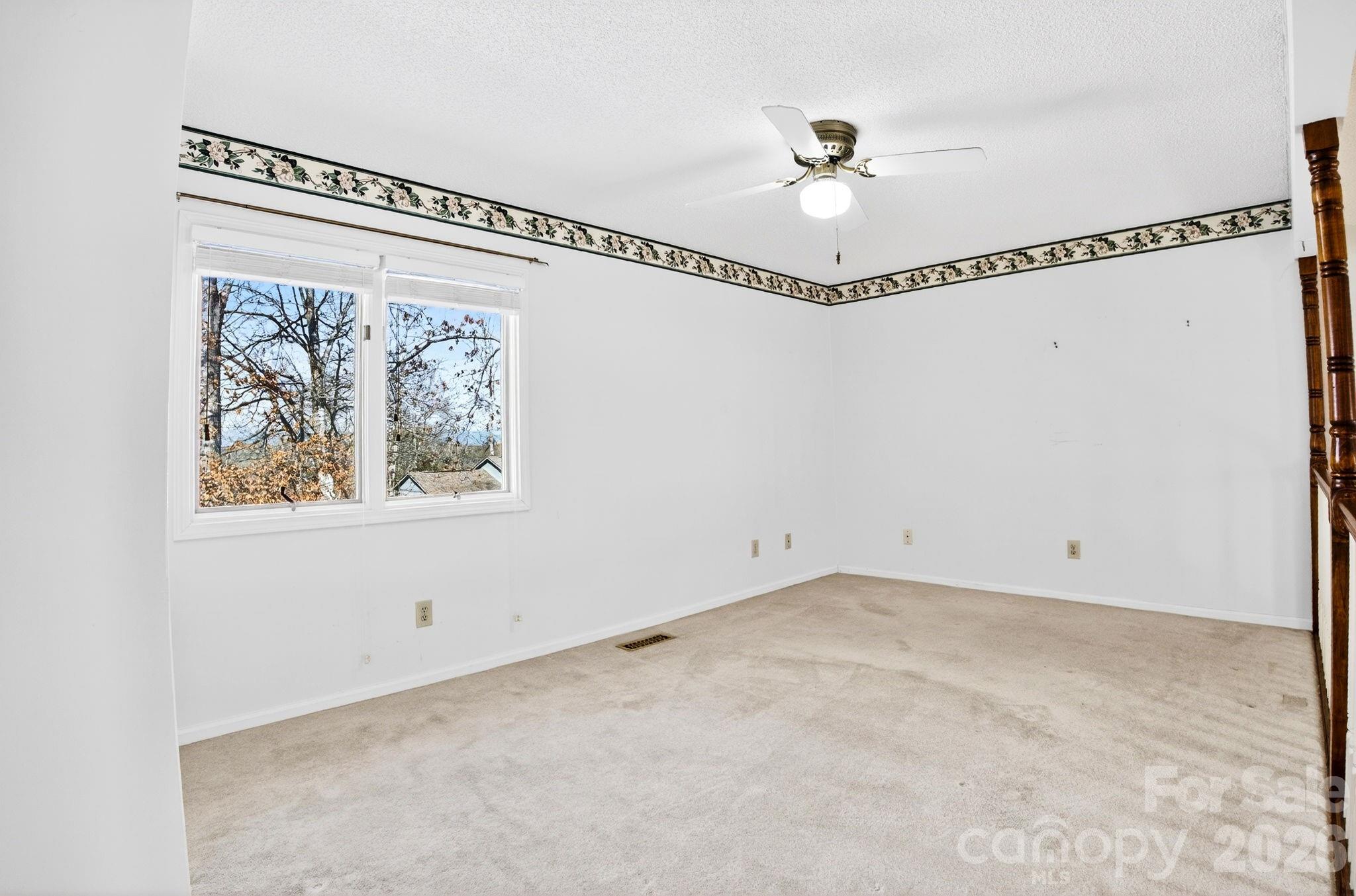 703 Independence Trail Morganton, NC 28655 - Photo 21 of 31 a view of a fan & a window in a room
