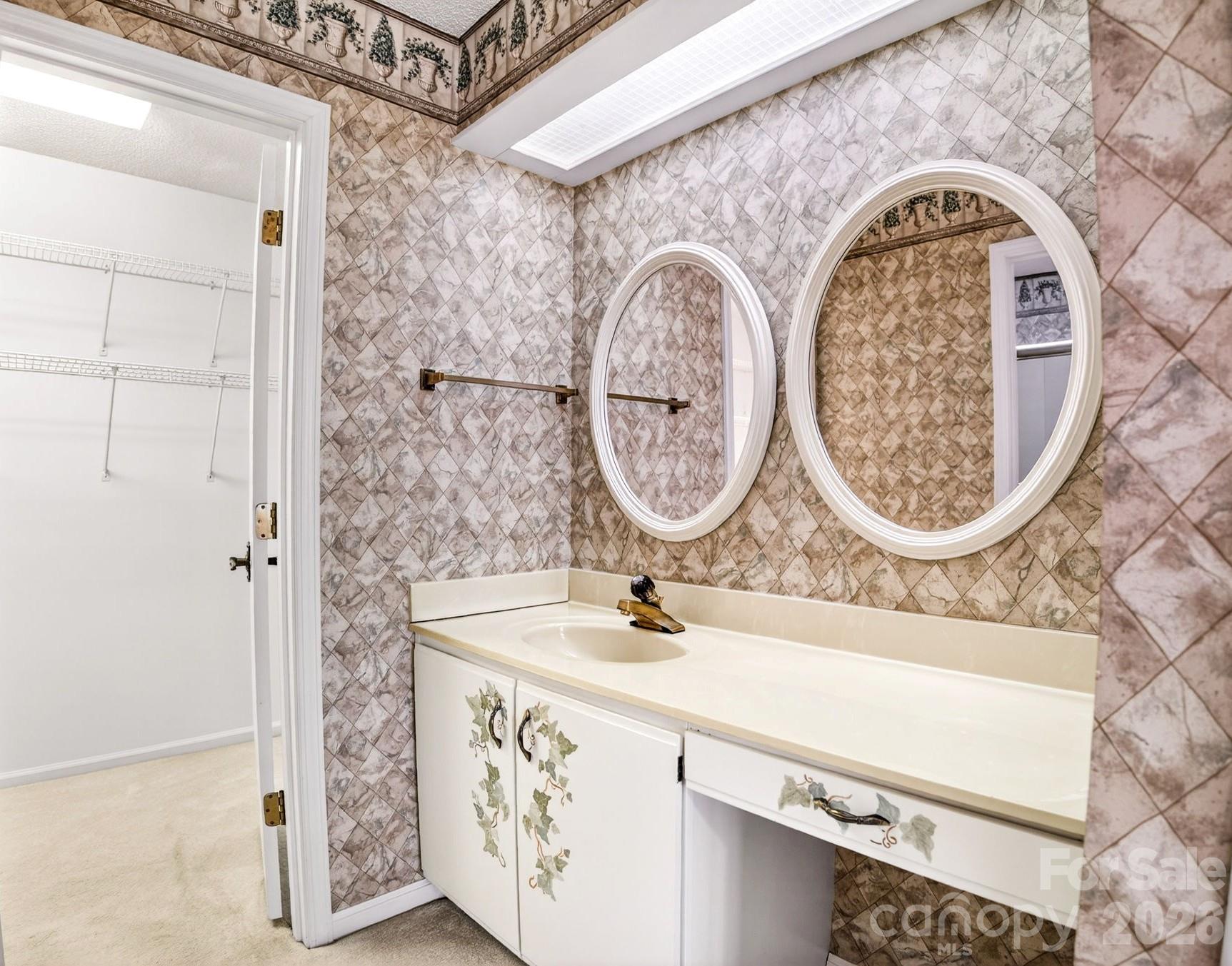 703 Independence Trail Morganton, NC 28655 - Photo 24 of 31 a bathroom with a sink and a mirror