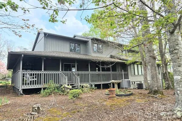 a picture of a bathroom with a white wall