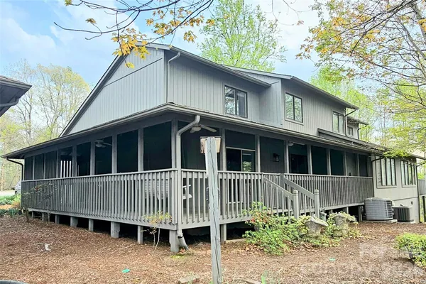 a view of a two chairs in the balcony