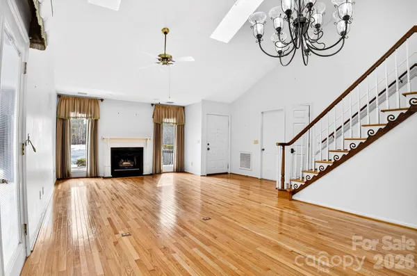 a view of entryway with wooden floor and stairs