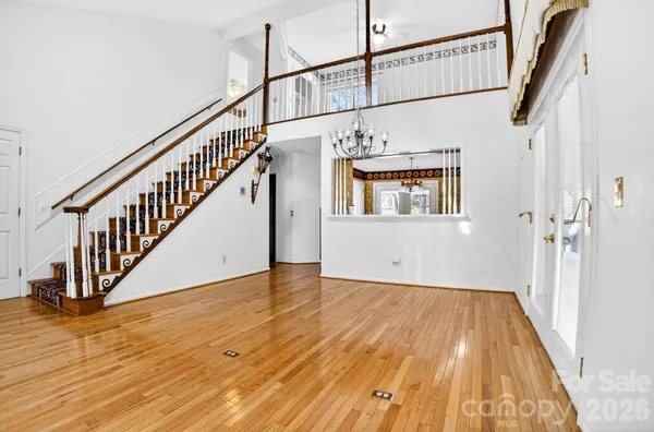 a view of an entryway with wooden floor