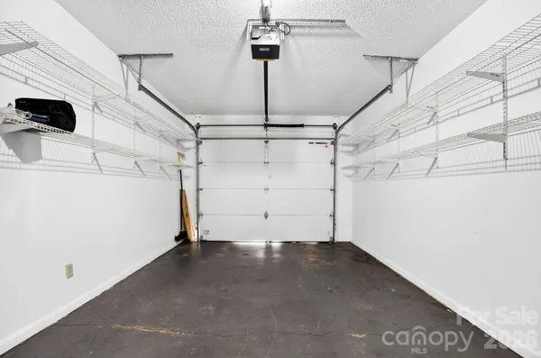 a kitchen with stainless steel appliances a refrigerator and microwave