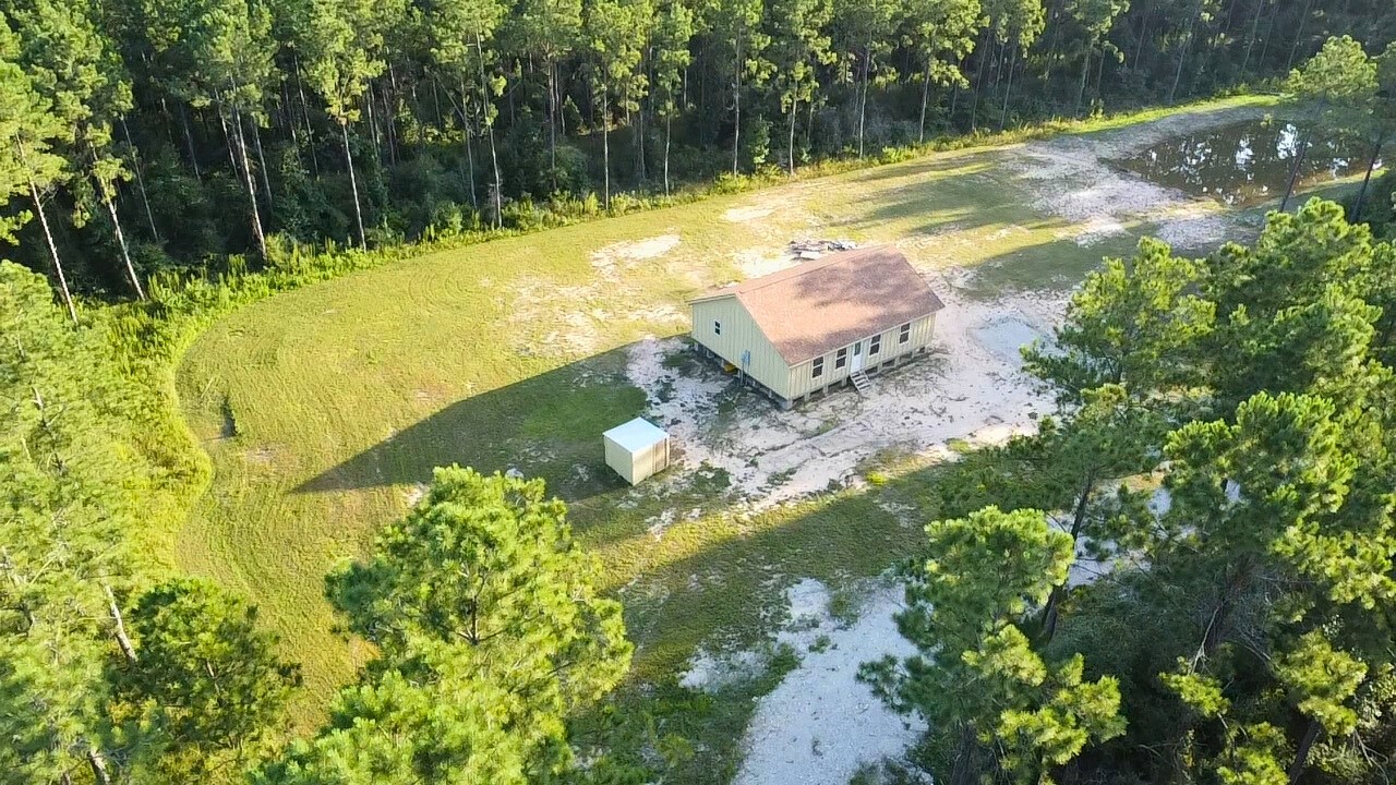 a view of a lake with a yard