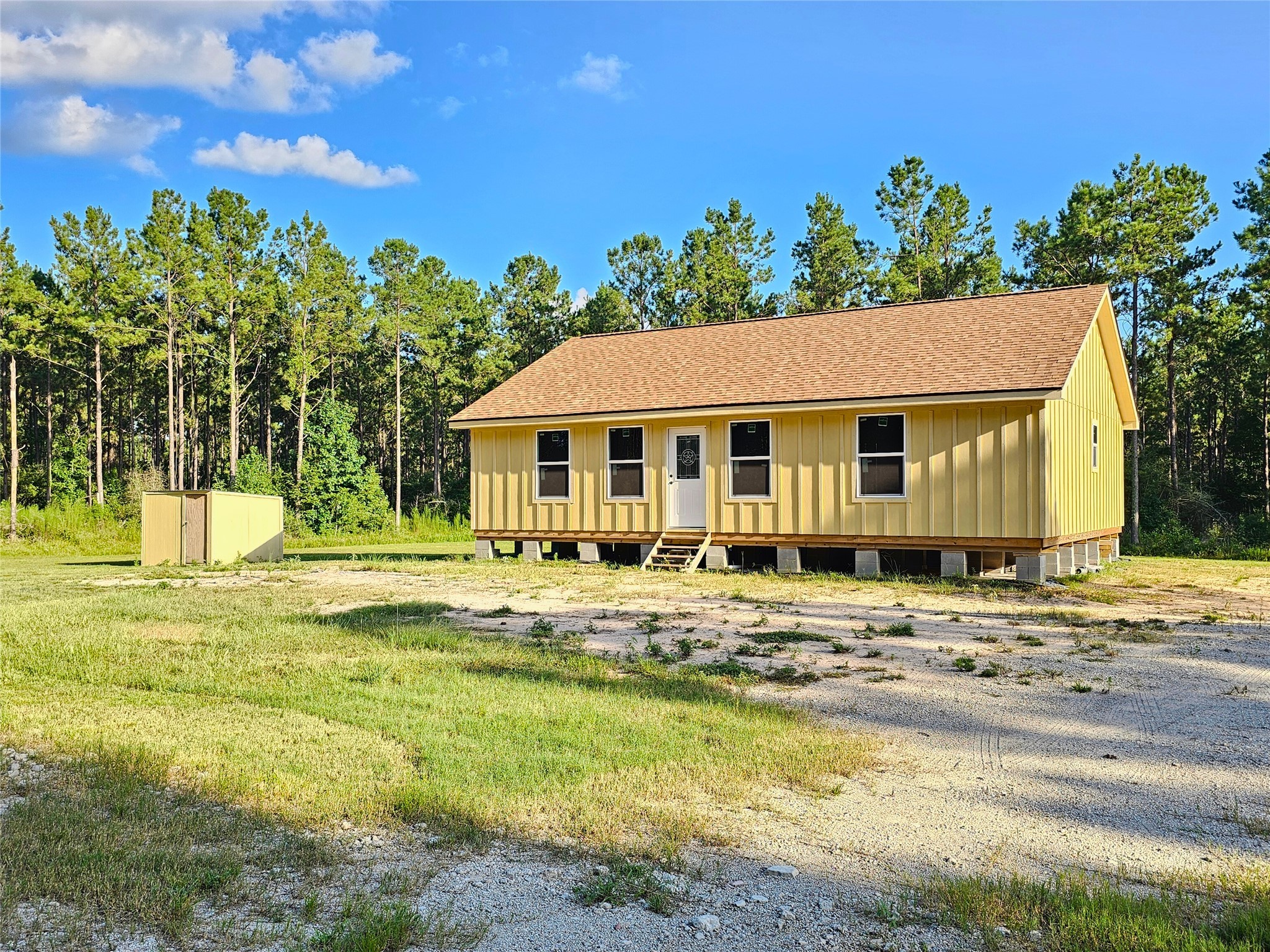 769 Tullos Loop Livingston, TX 77351 - Photo 3 of 23 a view of a house with a swimming pool