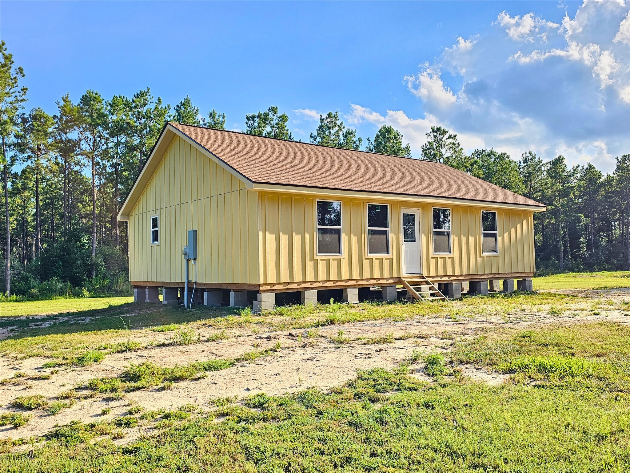 769 Tullos Loop Livingston, TX 77351 - Photo 4 of 23 a large pool that has lawn chairs under an umbrella