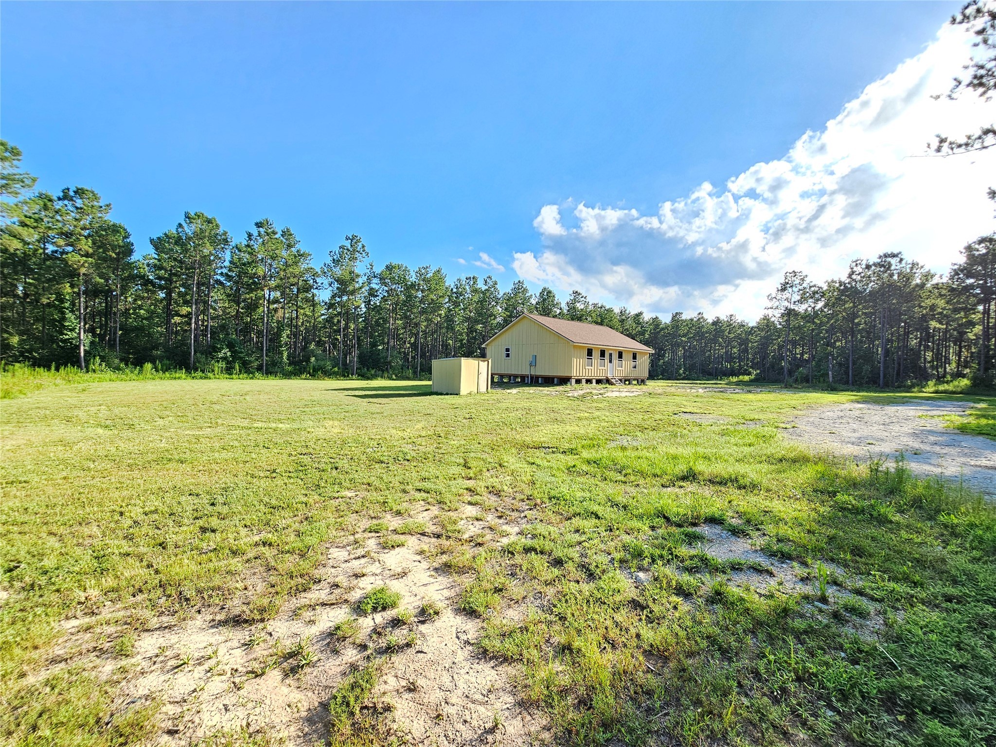 769 Tullos Loop Livingston, TX 77351 - Photo 7 of 23 a view of a swimming pool with an outdoor space and seating area