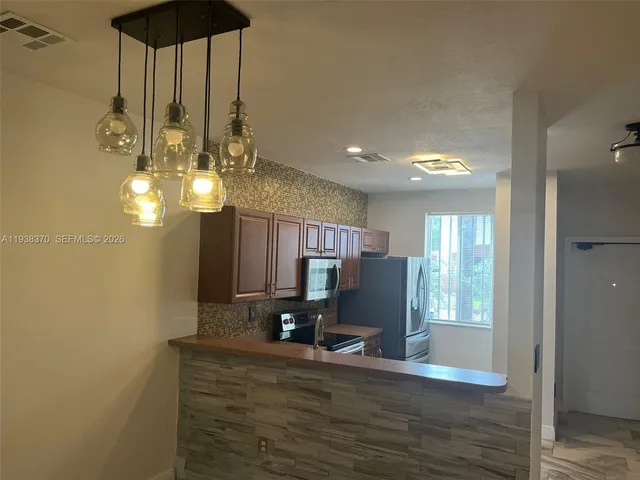 a view of dining room with wooden floor