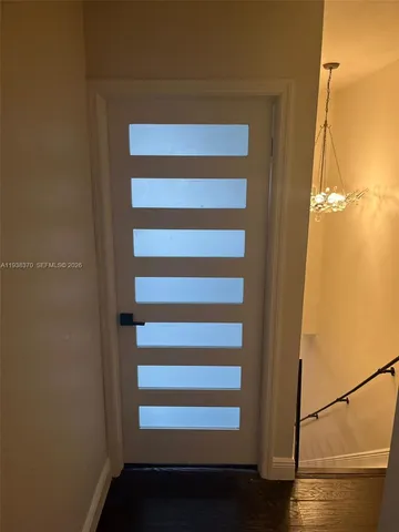 a view of entryway with wooden floor