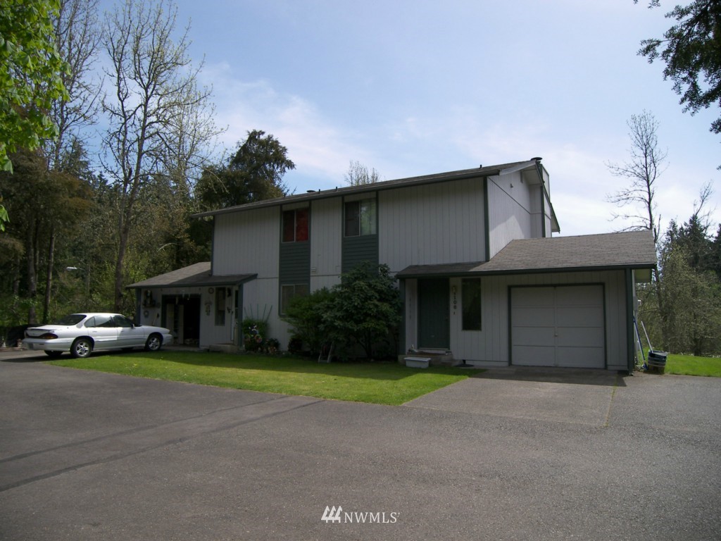 1104-1106 Military Road South Spanaway, WA 98387 - Photo 1 of 2 a house view with a garden space